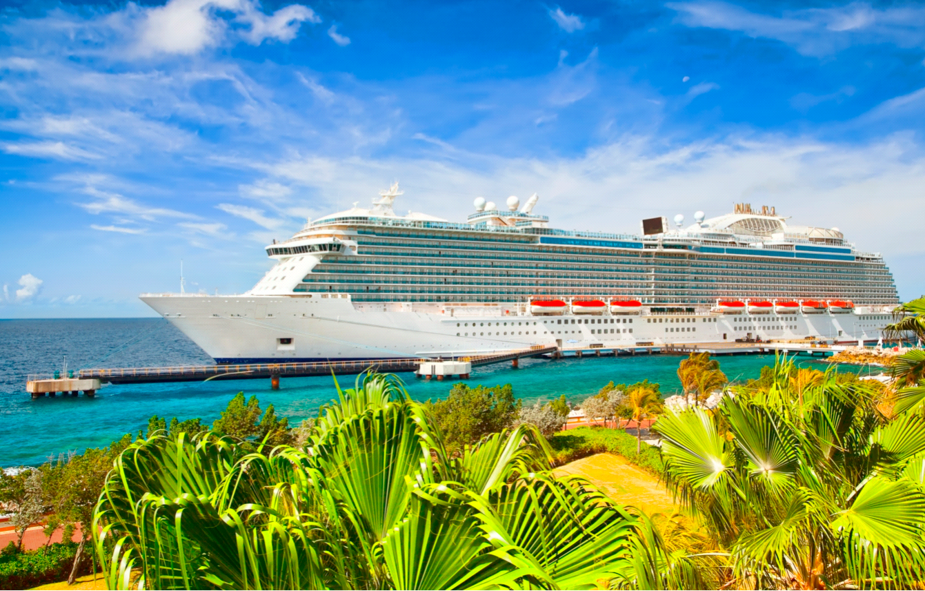 Cruise ship docked, sunny day in a tropical Caribbean island